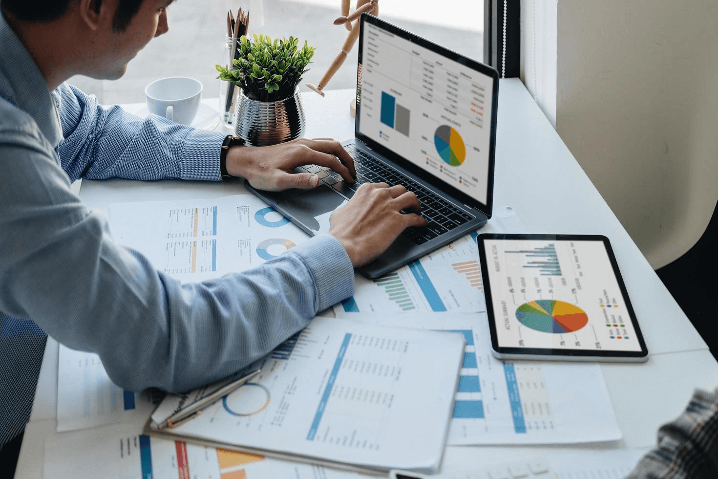Student studying accounting with financial data on laptop