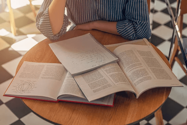 Books spread out on a table