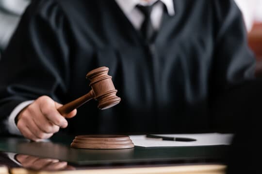 A zoomed in image of a court judge's gavel